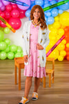 Mom & Me - Pink Pencil & Bow Dress - CHILD-3T - Pink sleeveless knee-length dress with pencil and bow print, paired with white cardigan and white sandals.