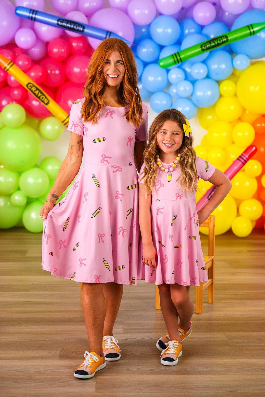 Mom & Me - Pink Pencil & Bow Dress - CHILD-3T - Pink short-sleeve dress with pencil and bow prints, knee-length pencil skirt for woman and matching flared dress for girl.