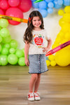 "Pre-K - Fifth Grade" Apple Denim Skirt Set - PRE-K / 2T - Cream short-sleeve top with red apple graphic paired with blue denim skirt featuring front button detail and scalloped hem.