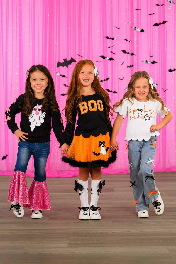 Bubblegum Ghost Denim Bell Bottom Set - 6-12 Months - Three girls wearing Halloween-themed casual outfits; one in black sweatshirt with pink cat and pink bell-bottom jeans, one.