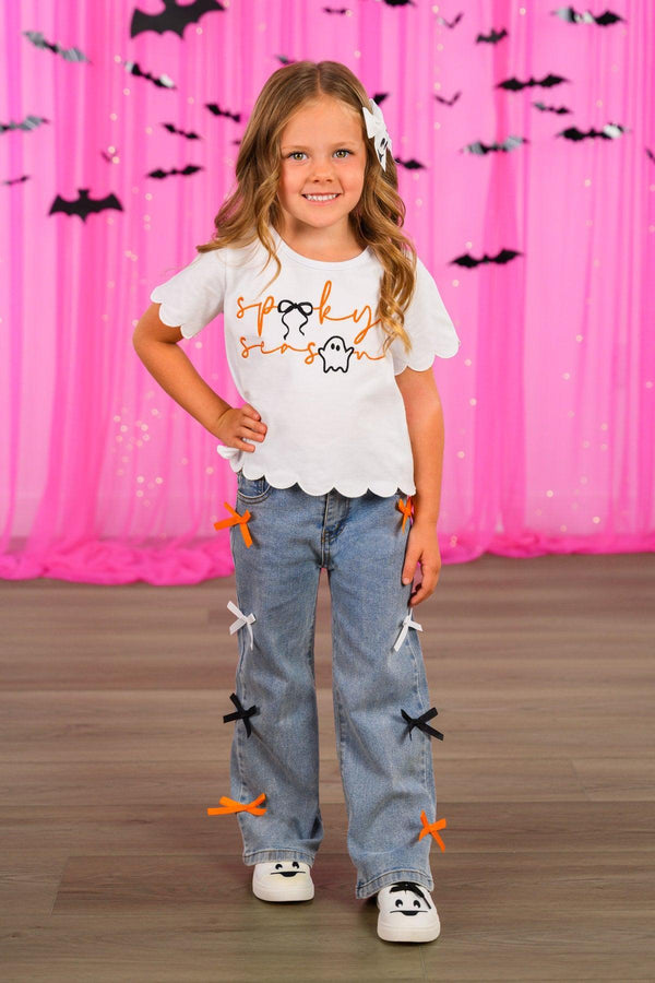 "Spooky Season" Bow Denim Pant Set - 6-12 Months - White short-sleeve t-shirt with "Spooky Season" text and bat graphic, paired with light blue denim pants featuring multiple.