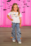 "Spooky Season" Bow Denim Pant Set - 6-12 Months - White short-sleeve top with scalloped hem and "Spooky" text paired with light blue denim pants featuring orange and black.