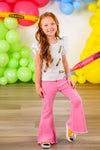 Pink Pencil Flare Denim Pant Set - 3T - Girl wearing pink flare denim pants and a white short-sleeve top with colorful popsicle prints.