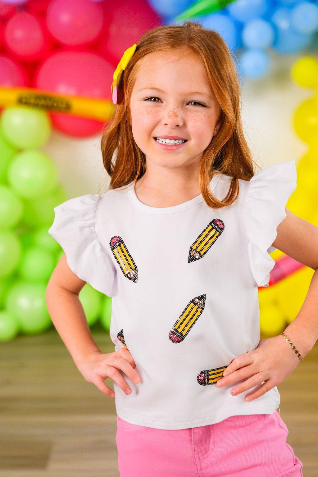 Pink Pencil Flare Denim Pant Set - 3T - White short-sleeve top with ruffled shoulders and yellow pencil prints, paired with pink flare denim pants.
