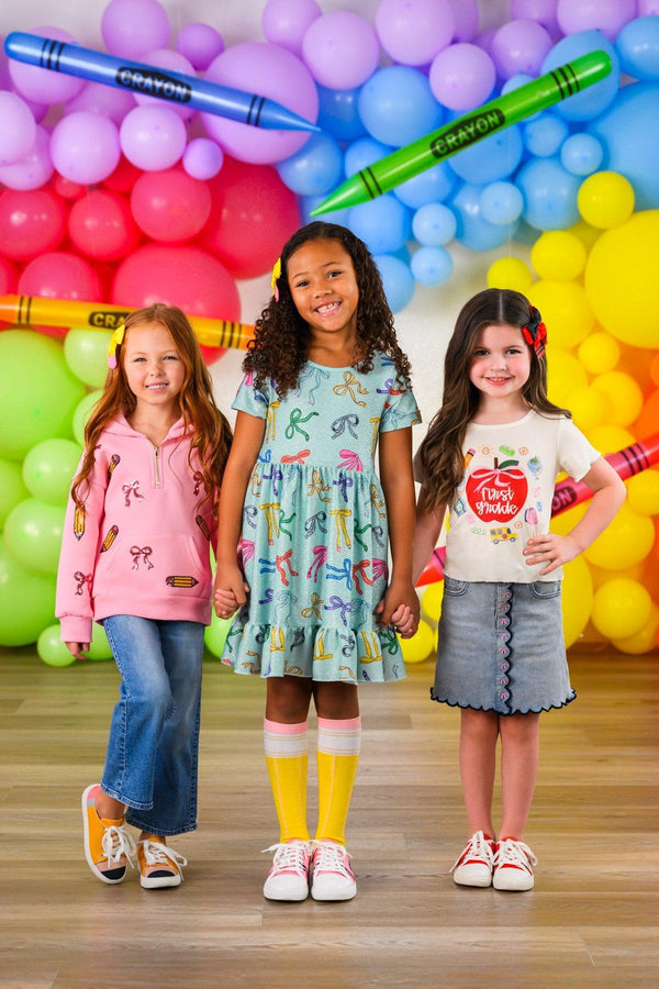 "Pre-K - Fifth Grade" Apple Denim Skirt Set - PRE-K / 2T - Girls wearing a light blue denim skirt with front buttons and a white long-sleeve top with a red apple graphic.