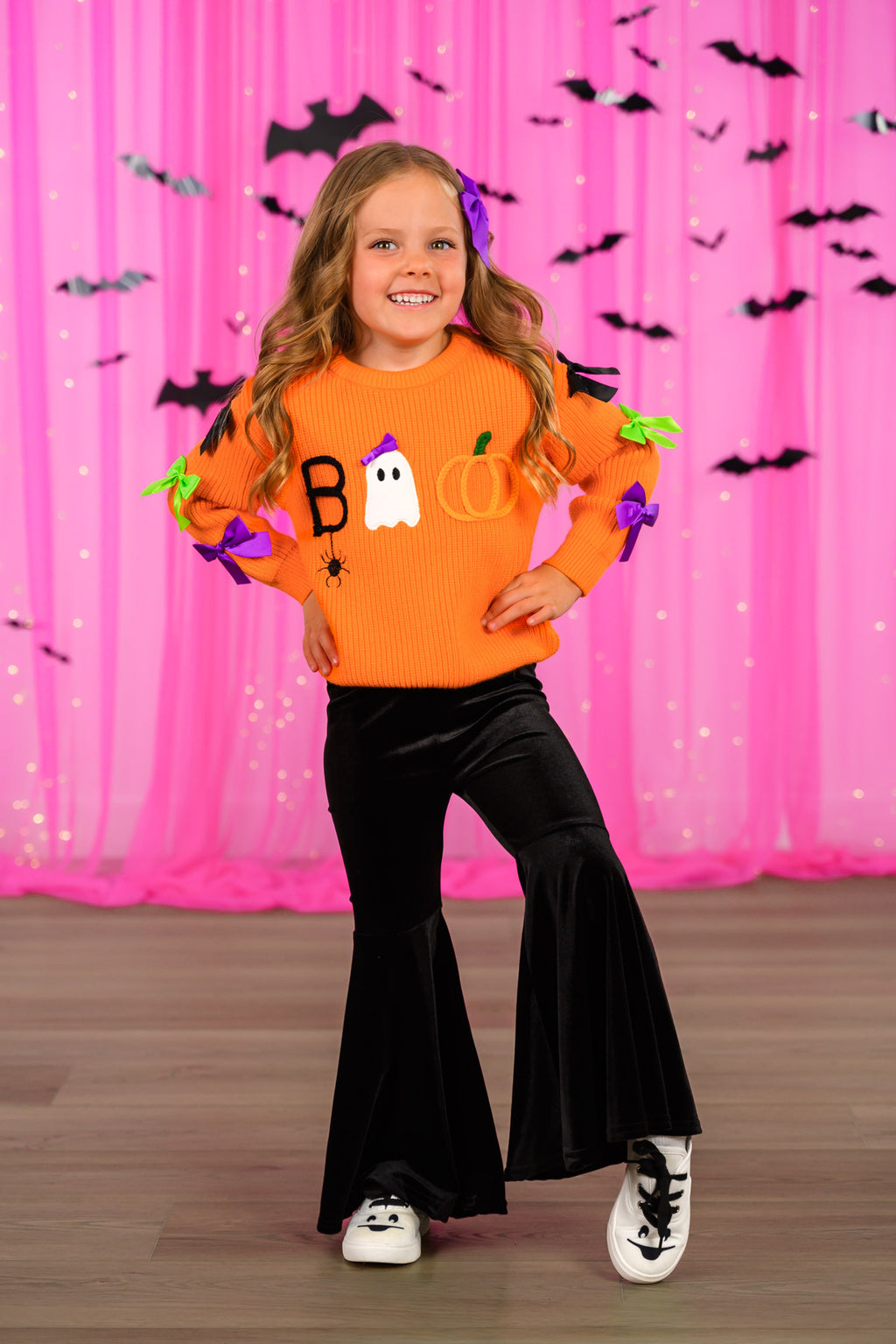 "Boo" Velvet Bell Bottom Set - 6-12 Months - Girl wearing an orange velvet top with Halloween ghosts and black velvet bell-bottom pants.