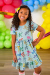 Mint Glitter School Bows Dress - 3T - Mint green short-sleeve dress with colorful glittery school bow prints, knee-length, gathered waist.