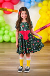Green Glitter School Supplies Dress - 3T - Green short-sleeve dress with glittery school supply prints and a large pink bow at the waist.