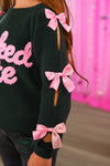 "Wicked Cute" Denim Flare Set - 6-12 Months - Black knit sweater with decorative pink bows on cut-out sleeve slits and pink "Wicked Cute" lettering on the front.