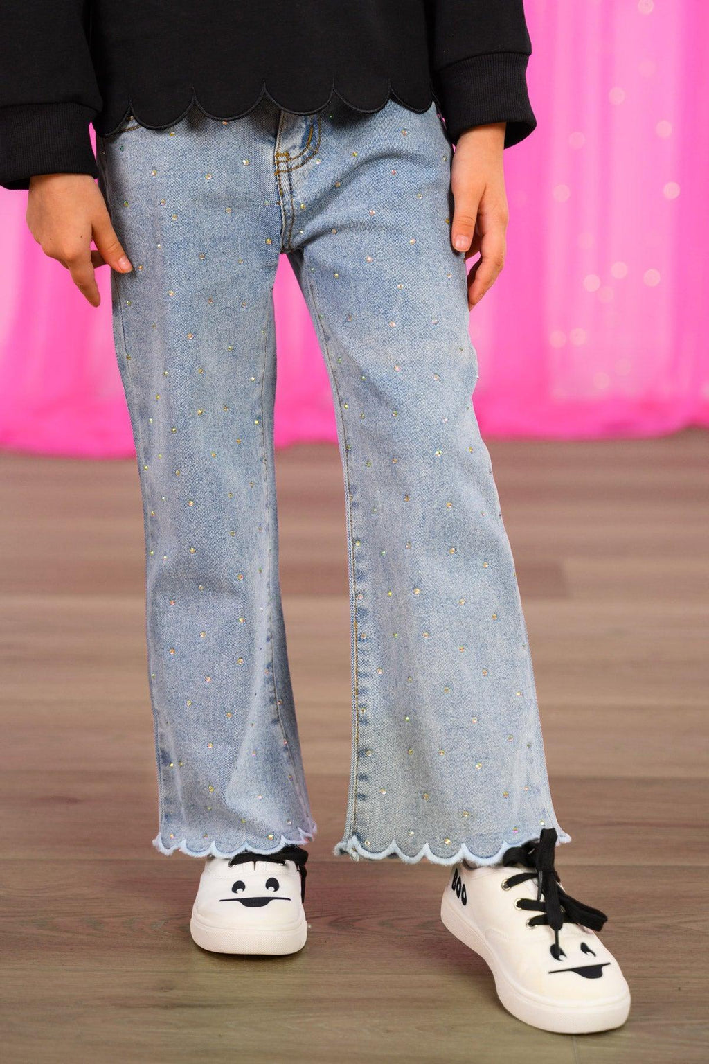 Rhinestone Ghost Denim Pant Set - 6-12 Months - Light blue denim pants with wide legs and scalloped hems worn with white sneakers and a black top.