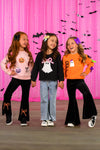 "Boo" Velvet Bell Bottom Set - 6-12 Months - Girls wearing Halloween-themed velvet bell bottom outfits in pink, black, and orange with festive prints and bow details.