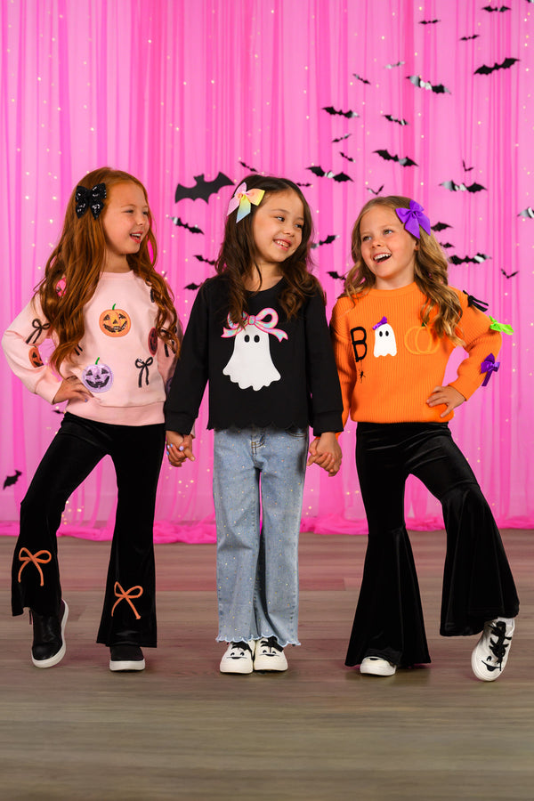 "Boo" Velvet Bell Bottom Set - 6-12 Months - Girls wearing Halloween-themed velvet bell bottom outfits in pink, black, and orange with festive prints and bow details.
