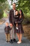 Family Navy & Rust Plaid Dress & Shirt - GIRL-0-3 Months-FAMILY - Family wearing matching navy and rust plaid outfits; plaid long-sleeve shirt on boy and man, plaid dress on woman and girl.