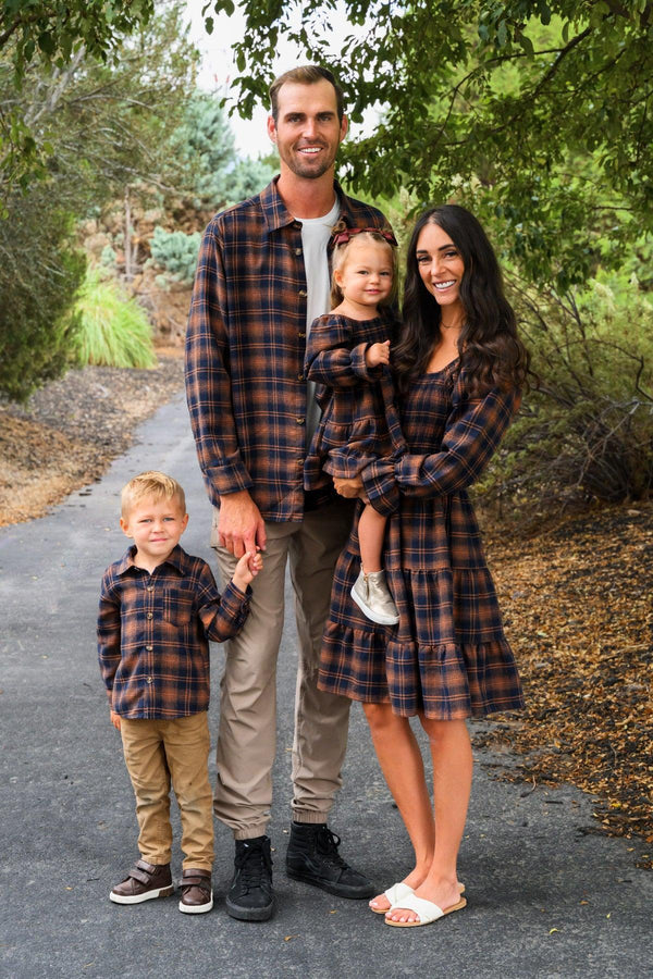 Family Navy & Rust Plaid Dress & Shirt - GIRL-0-3 Months-FAMILY - Family wearing matching navy and rust plaid outfits; plaid long-sleeve shirt on boy and man, plaid dress on woman and girl.