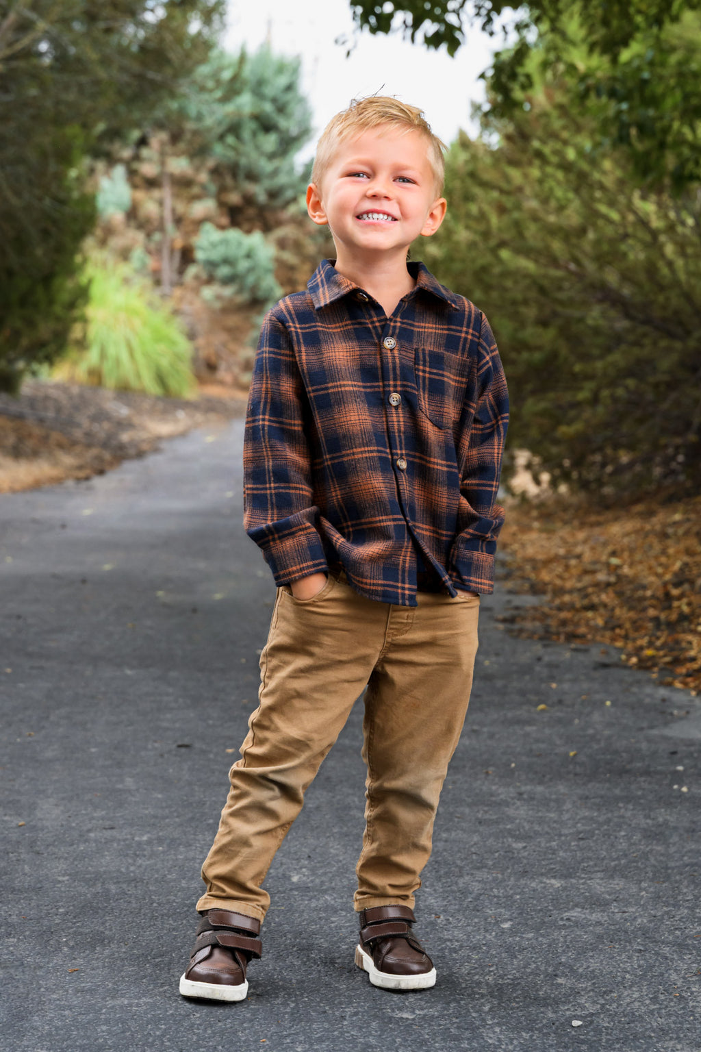 Family Navy & Rust Plaid Dress & Shirt - GIRL-0-3 Months-FAMILY - Navy and rust plaid button-up shirt paired with tan pants and brown sneakers on a smiling boy outdoors.