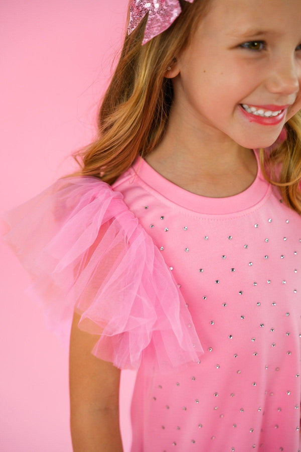 Pink Rhinestone Dress - 6-12 Months - Pink dress with sparkling rhinestones and sheer ruffled tulle sleeves on a child.