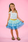 "Be Kind" Glitter Tutu Skirt Set - 6-12 Months - White sleeveless top with "Be Kind" blue glitter text paired with a blue and mint glitter layered tutu skirt.