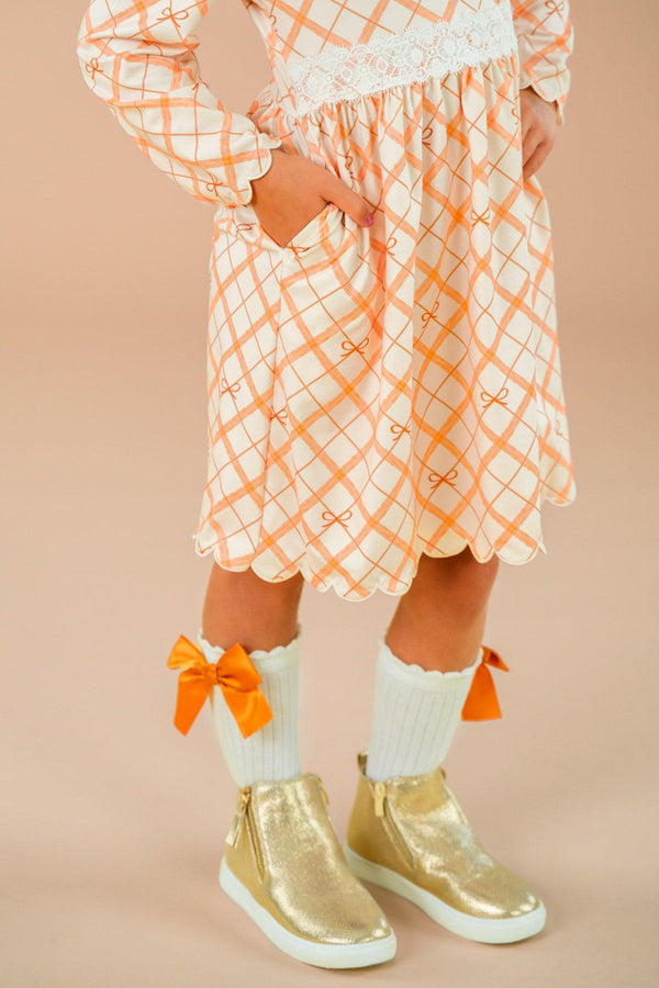 Orange Plaid Bow Dress - 6-12 Months - Orange and white plaid dress with long sleeves and a bow detail at the waist.