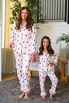 Mom & Me - Fuzzy Flower & Bow Pajamas - CHILD-6-12 Months - Cream-colored fuzzy pajamas with pink floral print and bow accents, long sleeves, and cuffed pants, worn by mother and.