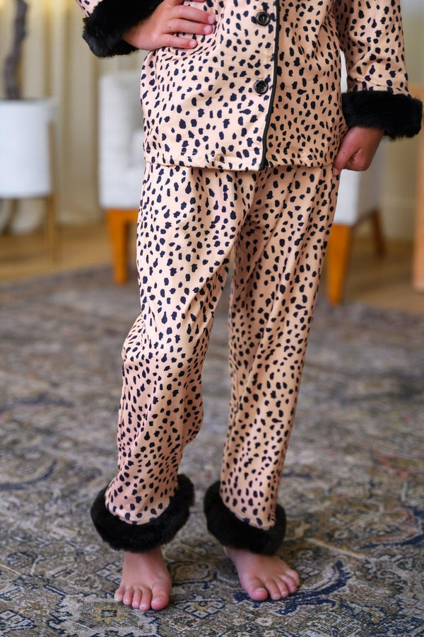 Mom & Me - Fuzzy Cheetah Pajamas - CHILD-6-12 Months - Light tan fuzzy pajamas with black cheetah spots, black faux fur trim on cuffs and pants hems.