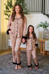 Mom & Me - Fuzzy Cheetah Pajamas - CHILD-6-12 Months - Matching fuzzy cheetah print pajamas with black trim worn by smiling mother and daughter in cozy home setting.