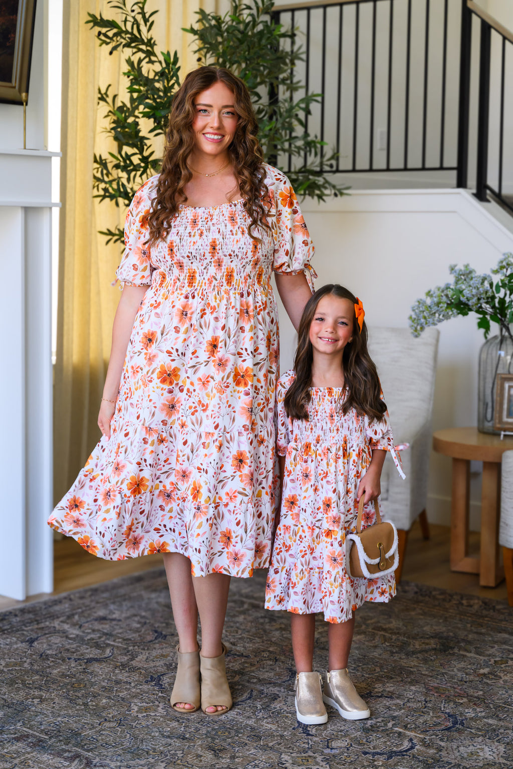 Mom & Me - Floral Fall Watercolor Dress - CHILD-6-12 Months - Cream knee-length dress with orange floral watercolor print, puffed sleeves, and tiered skirt.