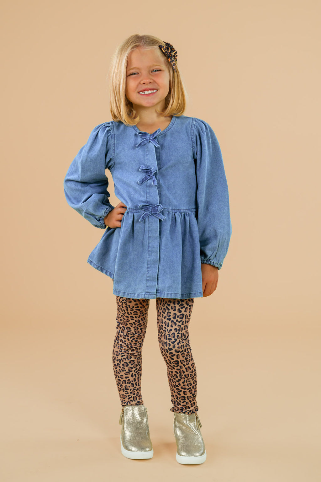 Faux Denim Cheetah Legging Set - 6-12 Months - Girl wearing a blue faux denim long-sleeve tunic with a tied waist and leopard print leggings paired with silver sneakers.