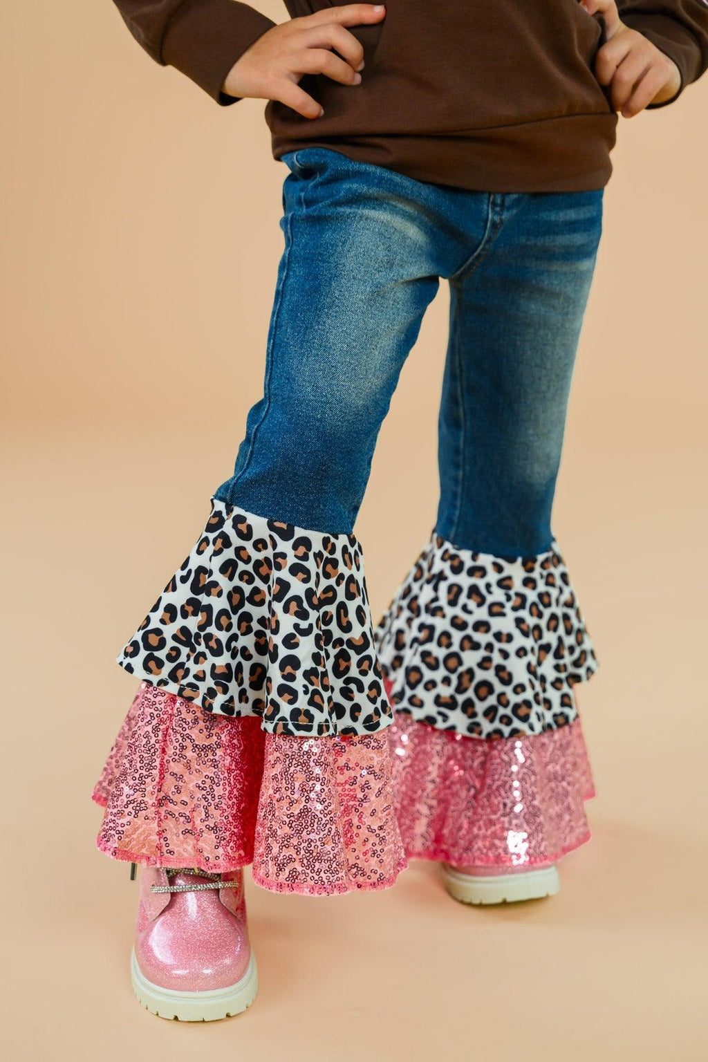 "Be Kind" Cheetah Denim Bell Bottom Set - 6-12 Months - Denim bell bottom pants with leopard print ruffle and pink sequined layered flare at the cuffs.