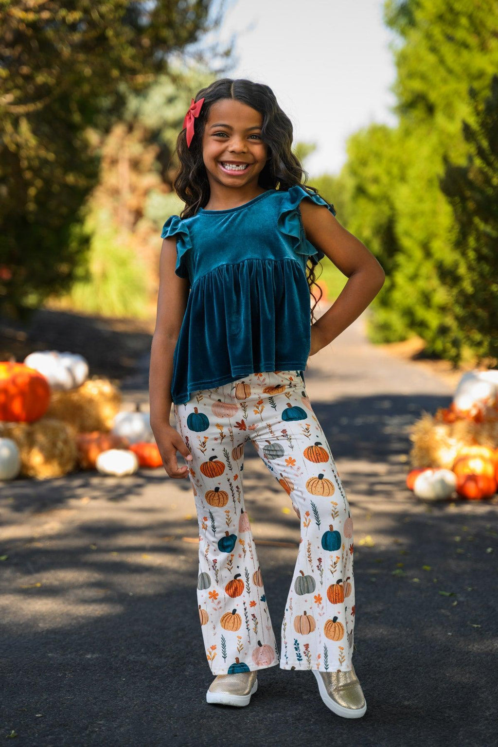 Velvet Pumpkin Flare Set - 6-12 Months - Turquoise velvet sleeveless top with ruffle shoulders paired with white flared pants featuring colorful pumpkin prints.