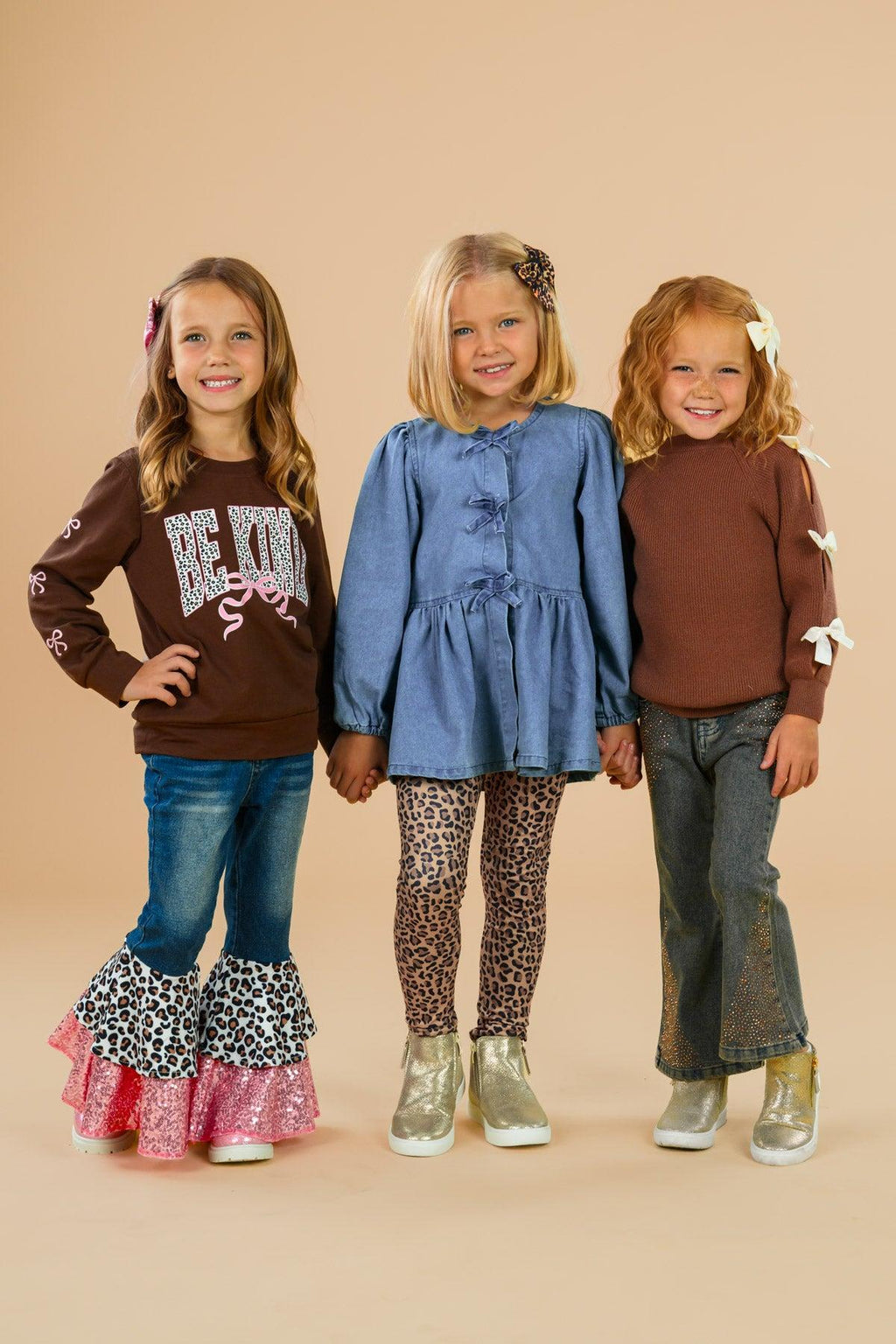 Faux Denim Cheetah Legging Set - 6-12 Months - Girls wearing casual outfits including faux denim leggings, cheetah print leggings, and brown tops with ruffle and bow.