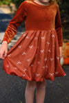 Rust Velvet Bow Dress - 6-12 Months - Rust velvet long-sleeve dress with bow-patterned gathered skirt and round neckline.