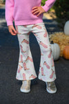 "Howdy" Pink Cowgirl Bell Bottom Set - 6-12 Months - White bell-bottom pants with pink cowgirl boot and hat print, worn with a pink sweater and silver shoes.