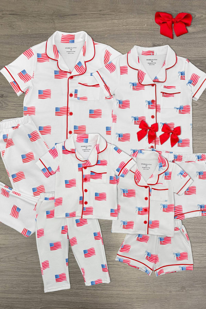 American Flag Family Pajama Set - GIRL-6-12 Months-FAMILY - White cotton American flag print family pajamas set with red piping, includes tops, bottoms, and red hair bows.