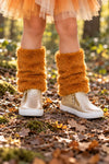 Fox Faux Fur Legwarmers - 6-12 Months - Brown fox faux fur legwarmers worn over white lace-up boots outdoors on leafy ground.