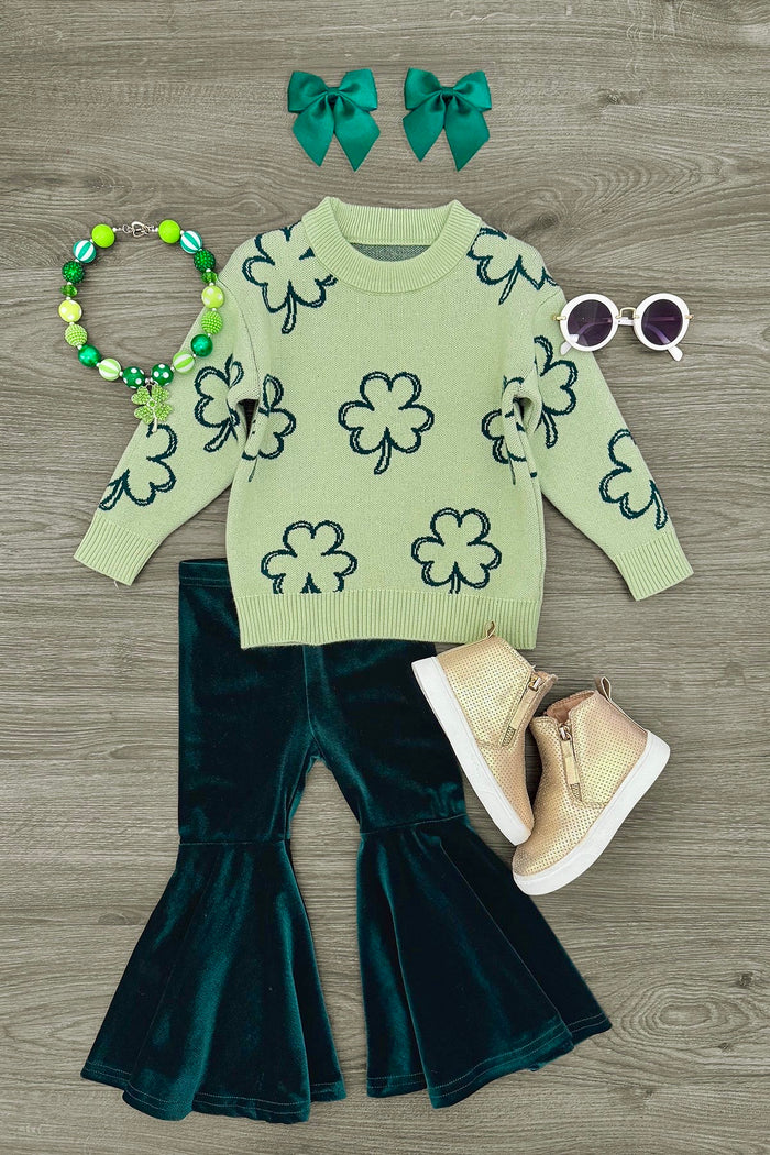 Shamrock Sweater Velvet Bell Bottom Set - 3XS-6-12 Months - Green sweater with black shamrock print paired with dark green velvet bell-bottom pants, beige boots, green bead necklace,.