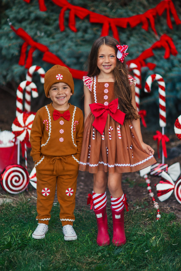 Gingerbread Costume - Boy Or Girl - GIRL-6-12 Months-FAMILY - Brown gingerbread-themed dress with red bow and candy cane striped socks; matching brown sweatshirt and pants with white and