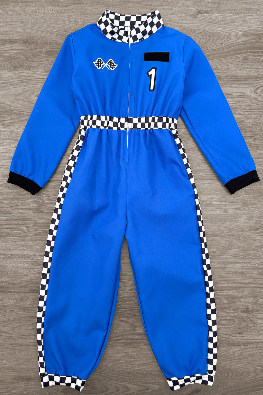 Family Racer Costume - BOY-6-12 Months-FAMILY - Blue racer jumpsuit with black-and-white checkered collar and side stripes, embroidered patches, and black cuffs.