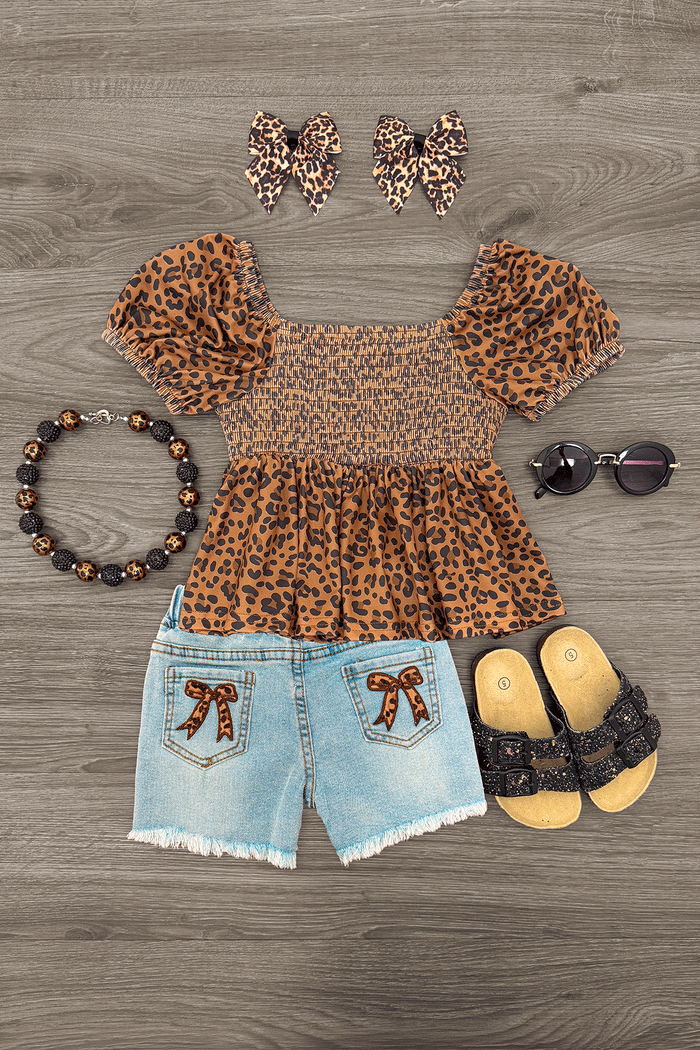 Cheetah Print Bow Denim Short Set - 6-12 Months - Toddler girl’s cheetah print puff sleeve top with light denim shorts featuring bow patches, paired with matching cheetah bow .