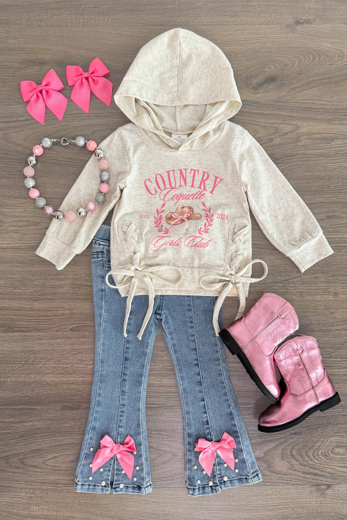 "Country Coquette Girls Club" Denim Flare Set - 3XS-6-12 Months - Cream hoodie with pink "Country Coquette Girls Club" text and bow ties at the waist, paired with denim flare jeans featuring .
