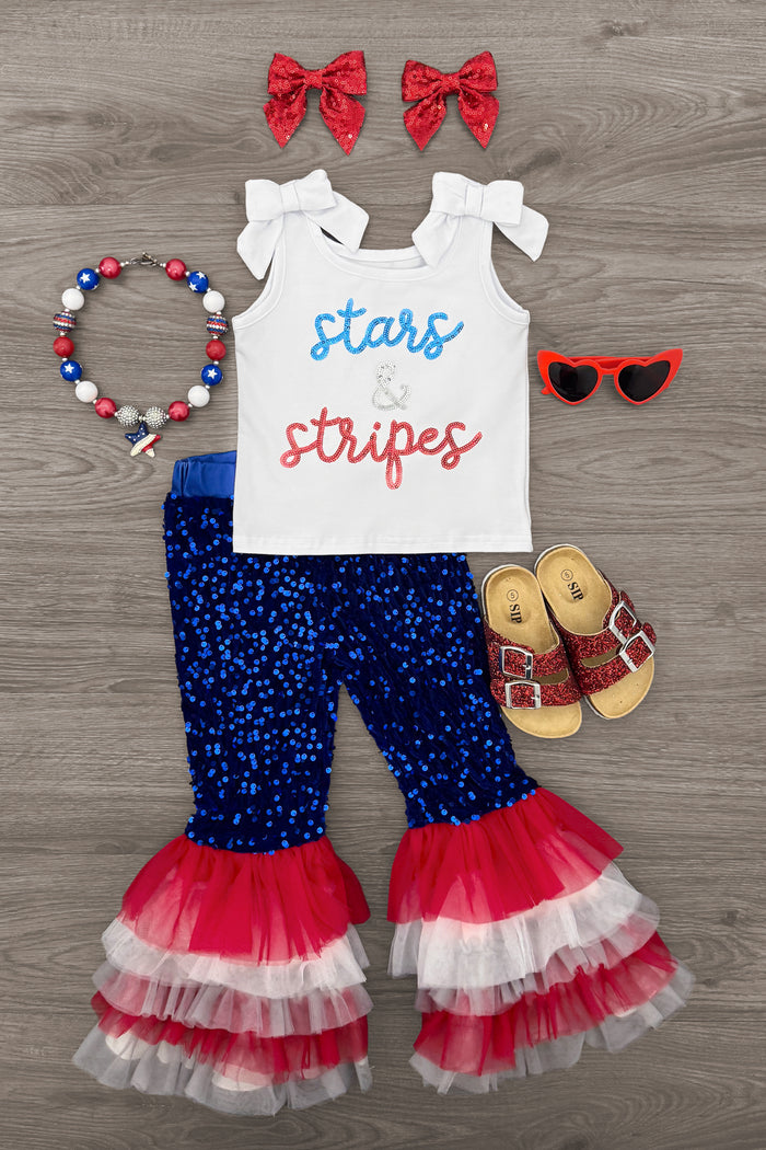 "Stars & Stripes" Sequin Bell Bottom Set - 6-12 Months - Toddler's white tank top with red and blue "stars stripes" text, blue sequin bell-bottom pants with layered red, white, and.