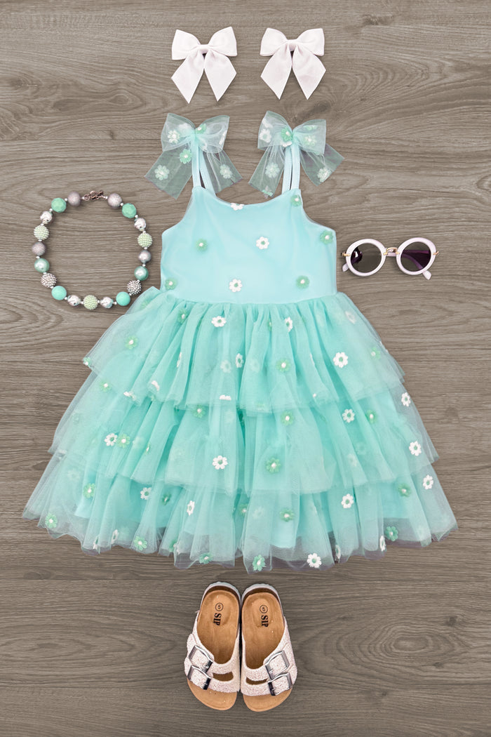 Mint Floral Tulle Dress - 6-12 Months - Mint green tiered tulle dress with white floral embroidery and bow straps, paired with white sandals, mint floral necklace,.