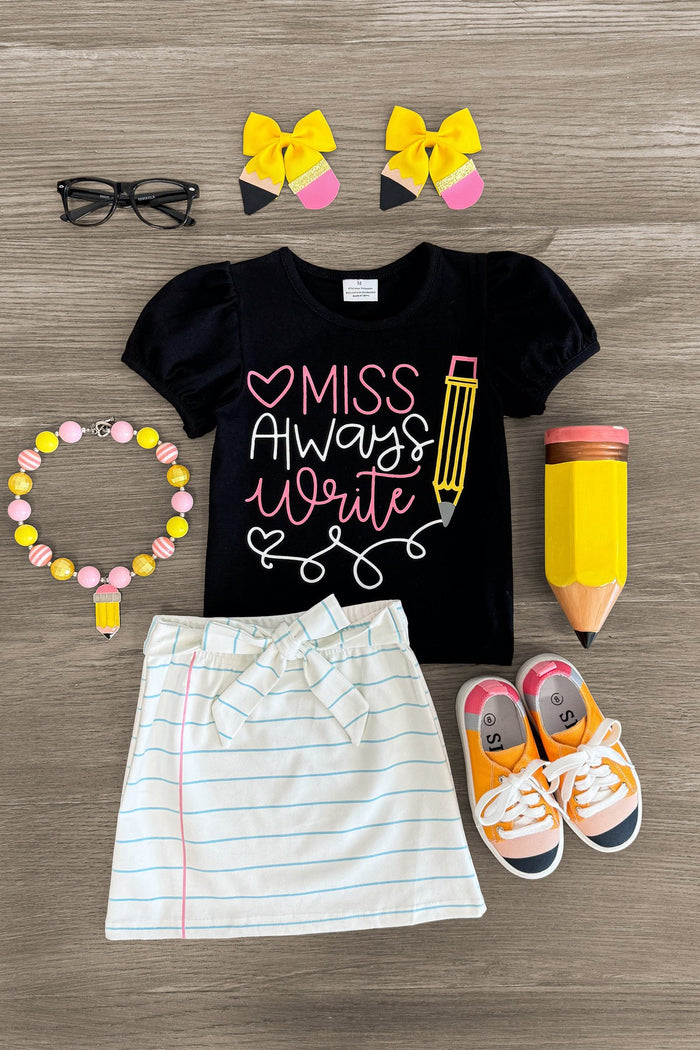 "Miss Always Write" Suede Skirt Set - 3T - Black short-sleeve tee with “Miss Always Write” text and pencil graphic, white striped skirt, yellow and pink hair bows,.