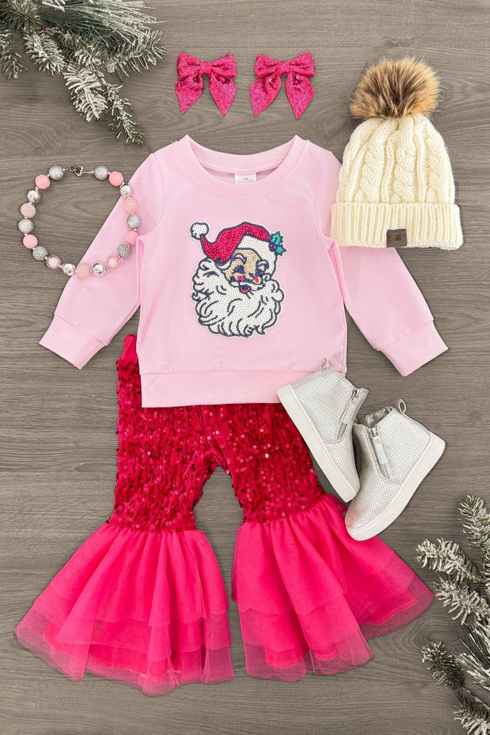 Pink Sequin Santa Bell Bottom Set - 3XS-6-12 Months - Pink long-sleeve shirt with Santa face, red sequin bell-bottom pants with pink tulle ruffles, white pom-pom knit hat, gray.