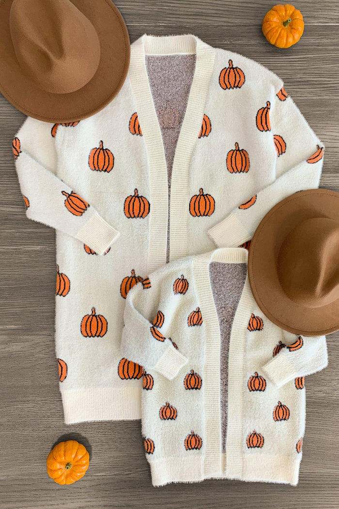 Mom & Me - Cozy Cream Pumpkin Cardigan - BABY-0-3 Months-FAMILY - Cream knit cardigans with orange pumpkin patterns in adult and child sizes, paired with brown hats and small pumpkins.