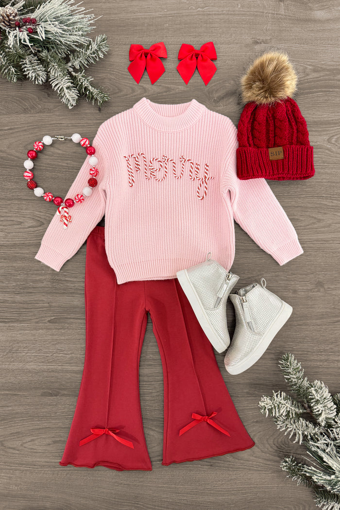 "Merry" Knit Pink Sweater Flare Pant Set - 3XS-6-12 Months - Pink knit sweater with "Merry" in red script, paired with red flare pants with bows at hems, white boots, red knit pom-pom.