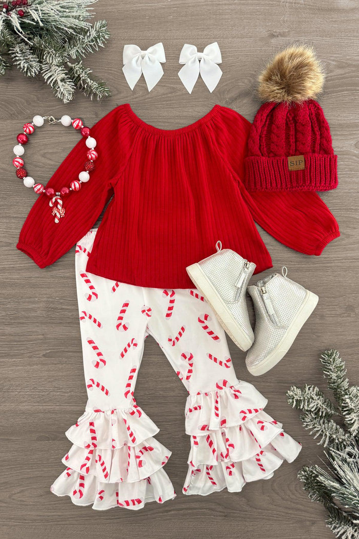 Red Candy Cane Ruffle Bell Bottom Set - 3XS-6-12 Months - Red long-sleeve top with candy cane print ruffle bell-bottom pants, white hair bows, red knit hat with pom-pom, and white.