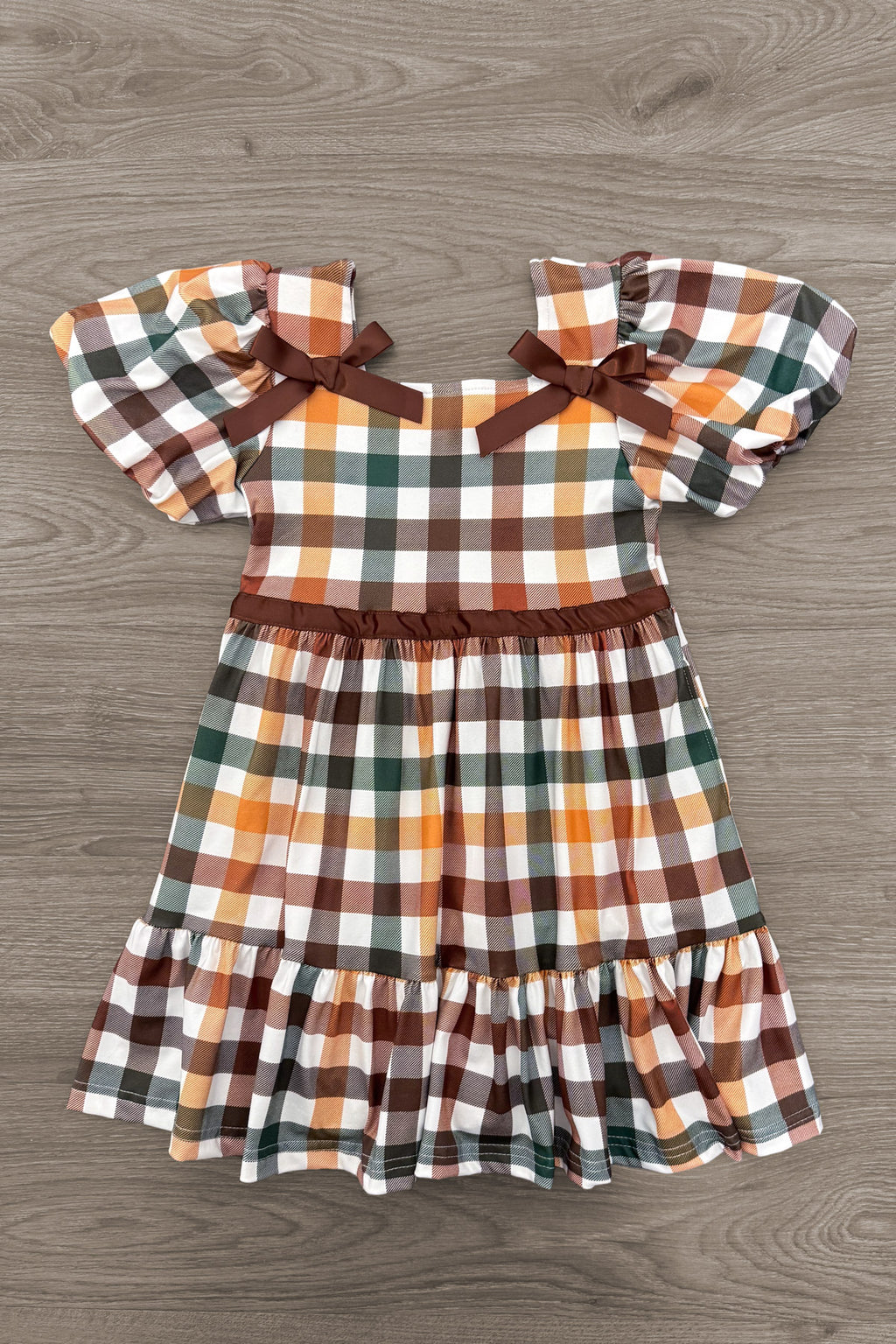 Green & Brown Checkered Top & Dress - Boy Or Girl - Girl / 6-12 Months - Green and brown plaid dress with puff sleeves and brown ribbon bows at shoulders.
