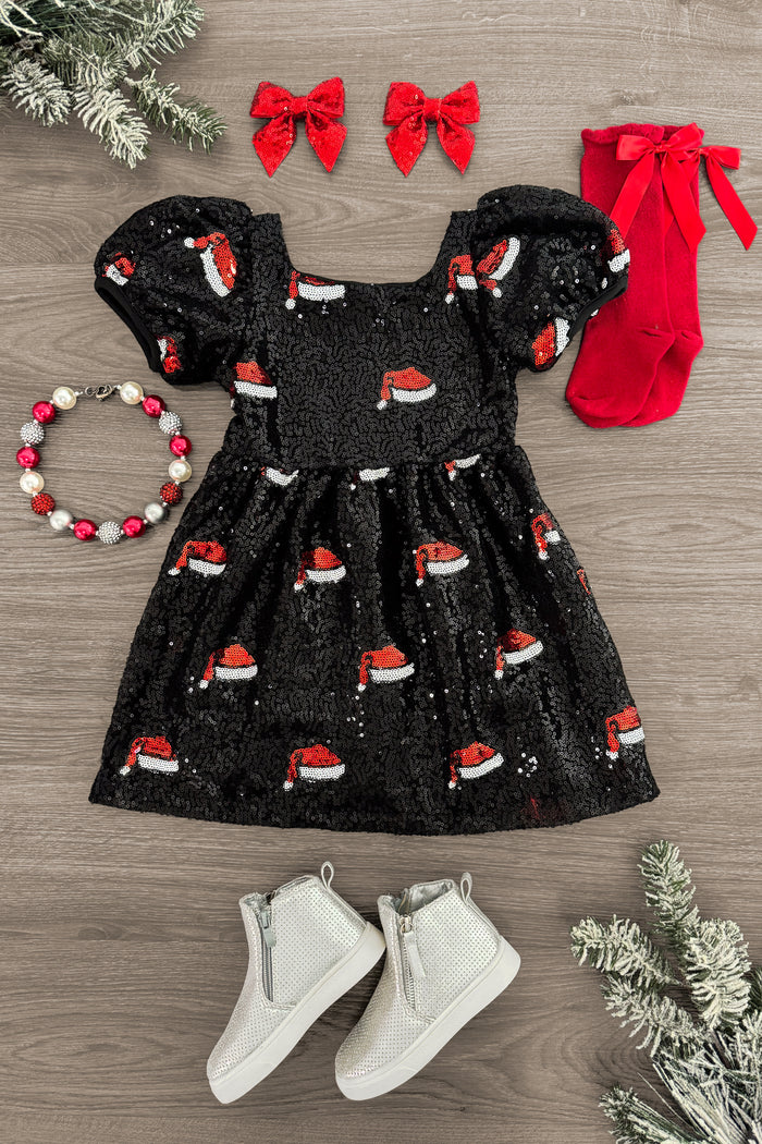 Black Sequin Santa Hat Dress - 3XS-6-12 Months - Black toddler dress with puff sleeves and Santa hat sequin pattern, paired with red bow clips, red socks, beaded bracelet,.