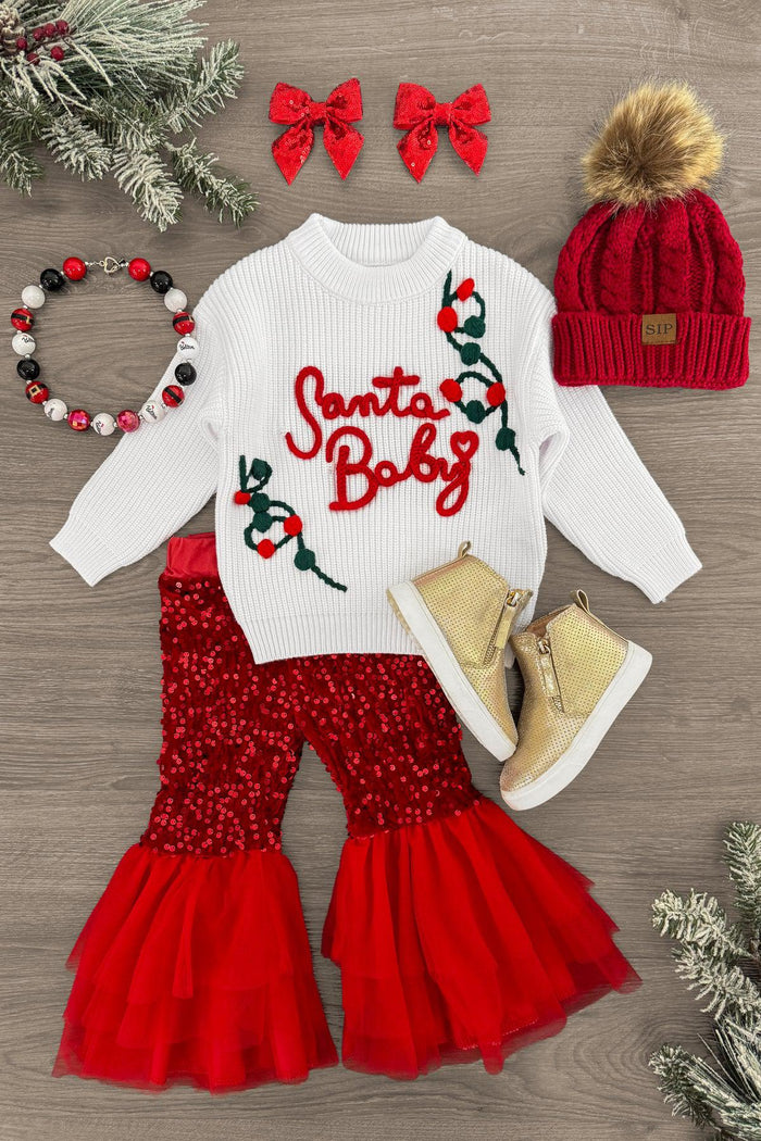 "Santa Baby" Sweater Sequin Bell Bottom Set - 3XS-6-12 Months - White long-sleeve sweater with red "Santa Baby" text and green holly accents, paired with red sequin bell-bottom pants with.