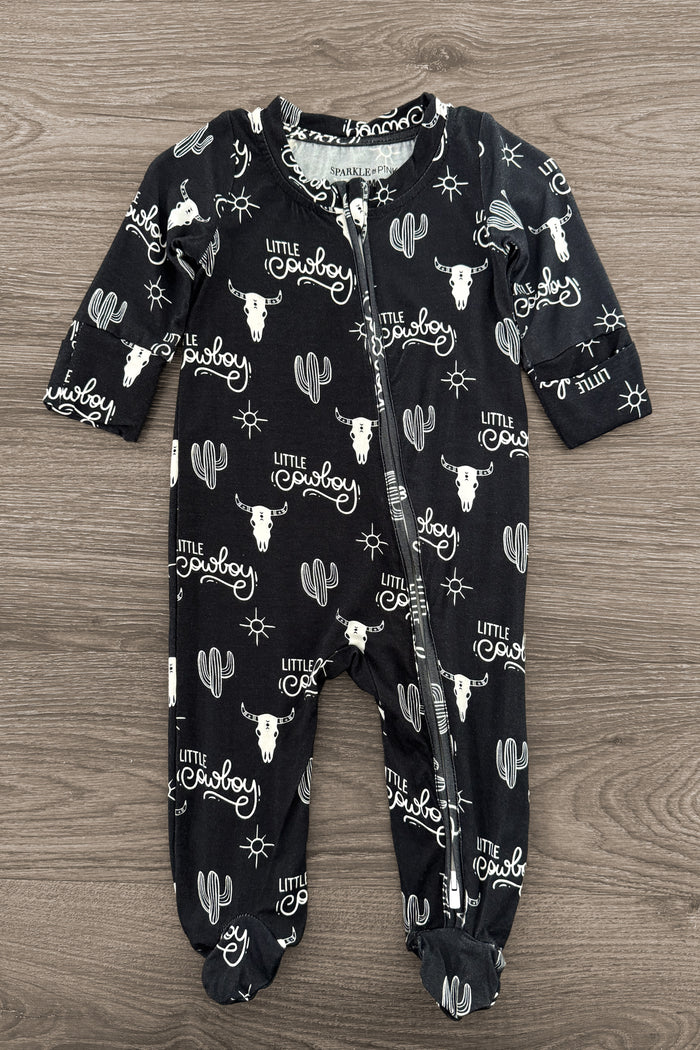 Bamboo "Little Cowboy" Onesie - Newborn - Black bamboo onesie with white cactus and "Howdy" text pattern, long sleeves, and snap buttons down front.